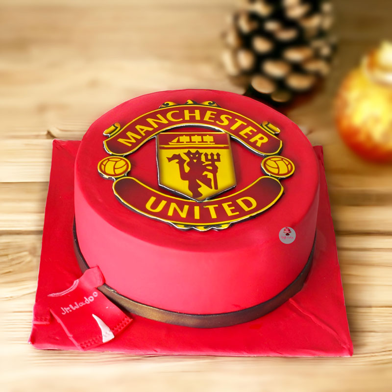 A Manchester United eggless cake decorated with the logo of the club  delivered to Delhi and Noida
